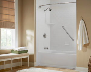 A new bathtub/shower combination silver fixtures and white subway tile walls.